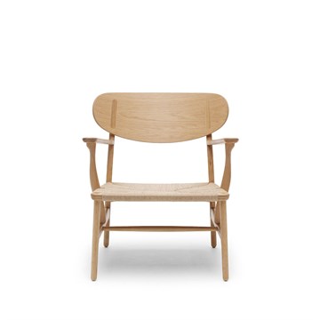Carl Hansen & Søn CH22 Lounge stol designet av Hans J. Wegner